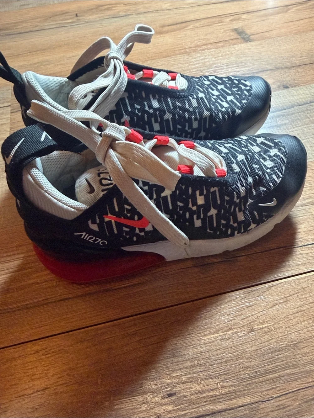 Nike Black and White Patterned Sneakers with Red Eyelet Accents